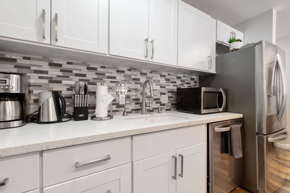 Kitchen - microwave, toaster oven, instahot, coffee maker and kettle