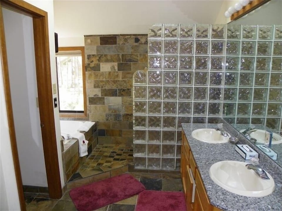 Master bath - custom glass block shower, slate and granite, oversize jacuzzi tub