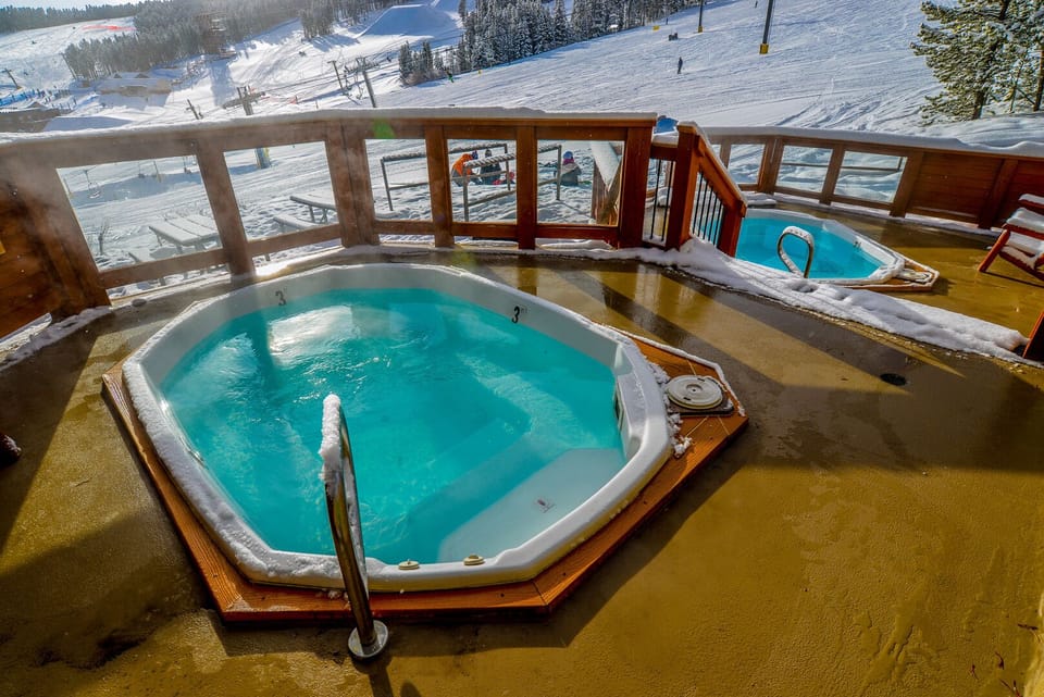 Enjoy a cool beverage in the hot tubs while watching the last riders of the day