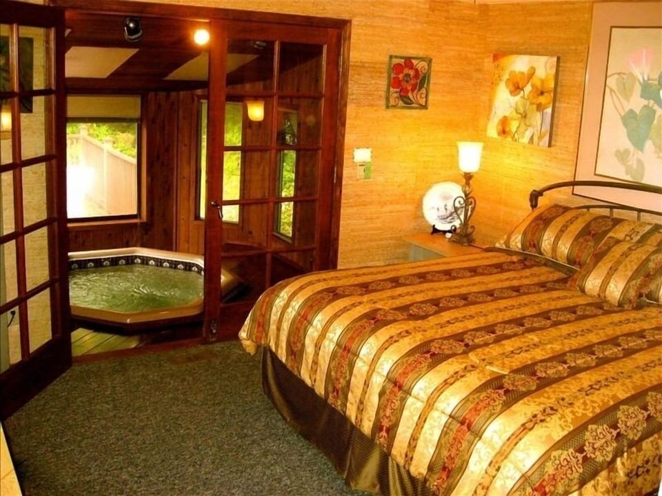 Fit for a king! Enjoy easy access to the hot tub from the master bedroom