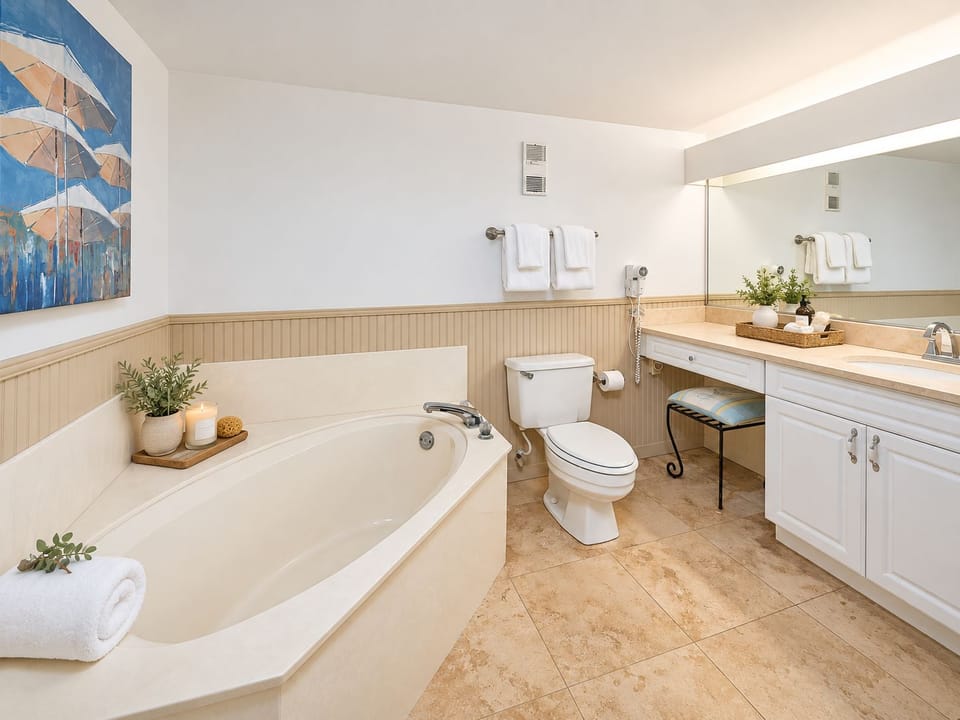 Primary Bathroom 1 offers a spacious vanity and soaking tub for a relaxing start or end to the day.