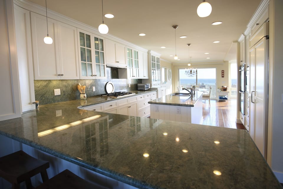 Gas cooktop, double sink, double over, microwave, and dishwasher plus views! 