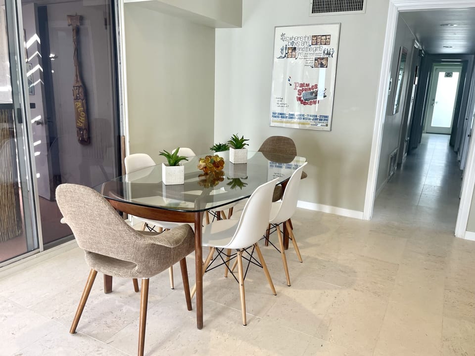 Min-century dining table with 6 chairs.  Additional chairs available as well