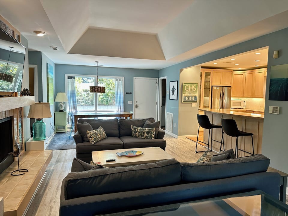 Main living area with a view to dining room and front door