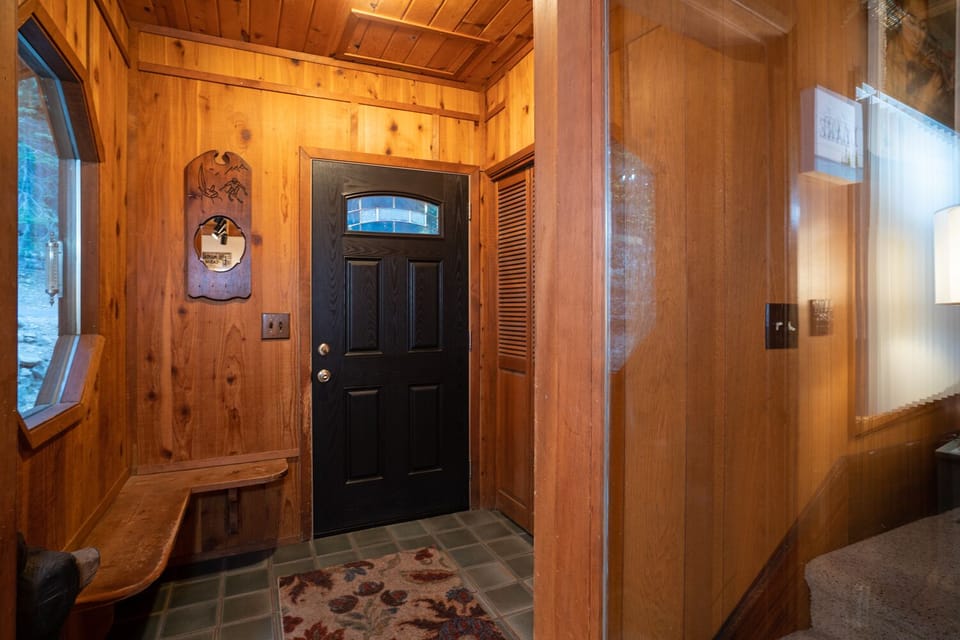 A large mud room greets you as you enter, offering ample space for boots, jackets, and outdoor gear, making it the perfect transition area after a day of exploring