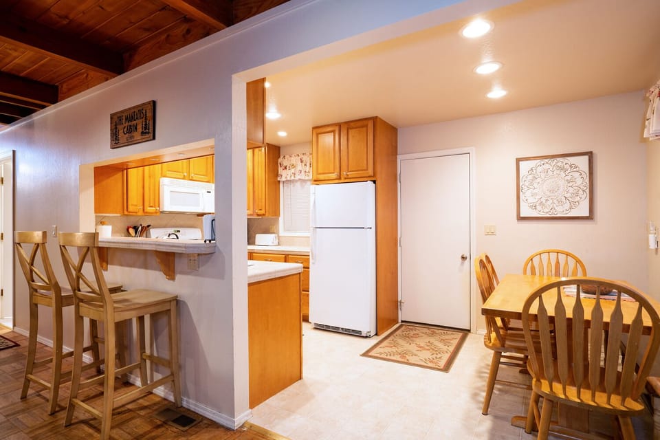 This cozy dining room is ideal for everyday meals, offering a relaxed and comfortable space to enjoy time together