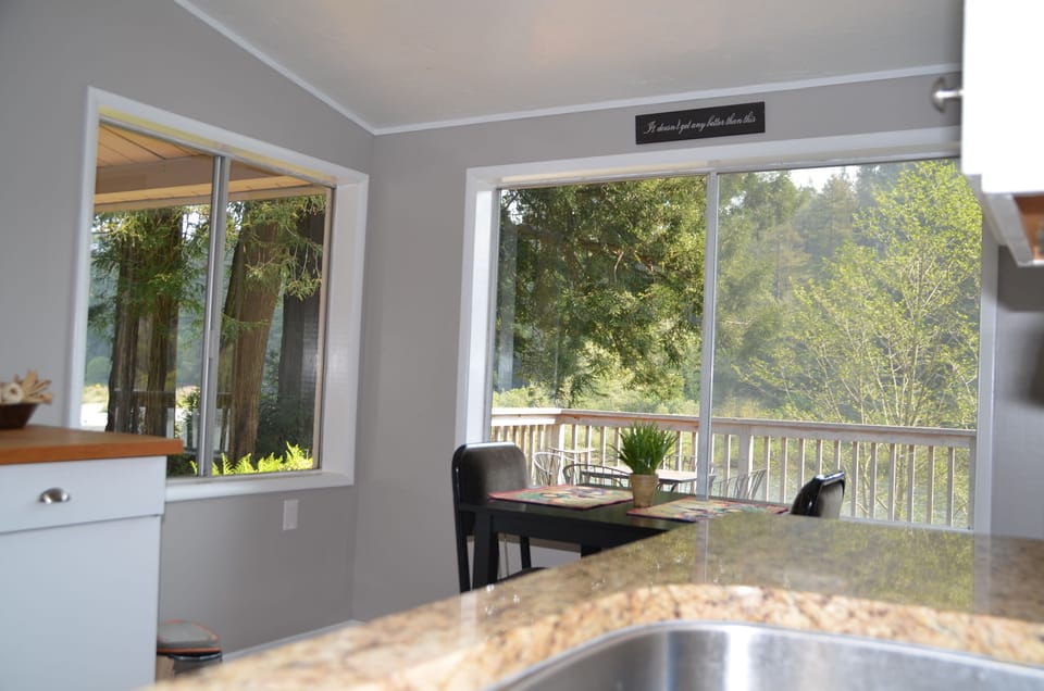 Fully equipped kitchen with granite countertops and wood floors