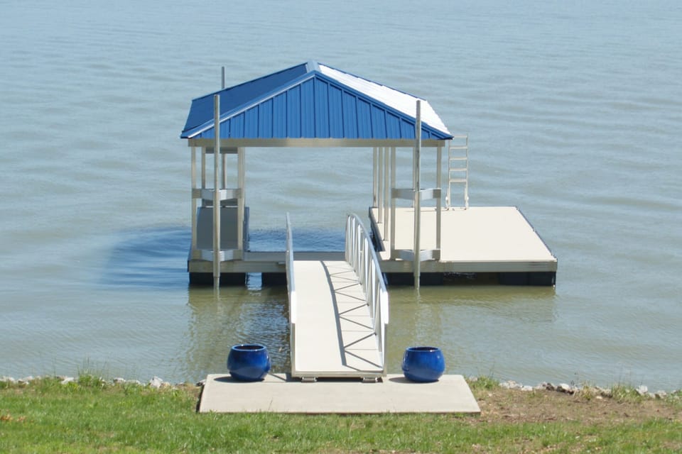 The Private Covered Dock - Depth at Summer Pool is 6 -7 ft.   