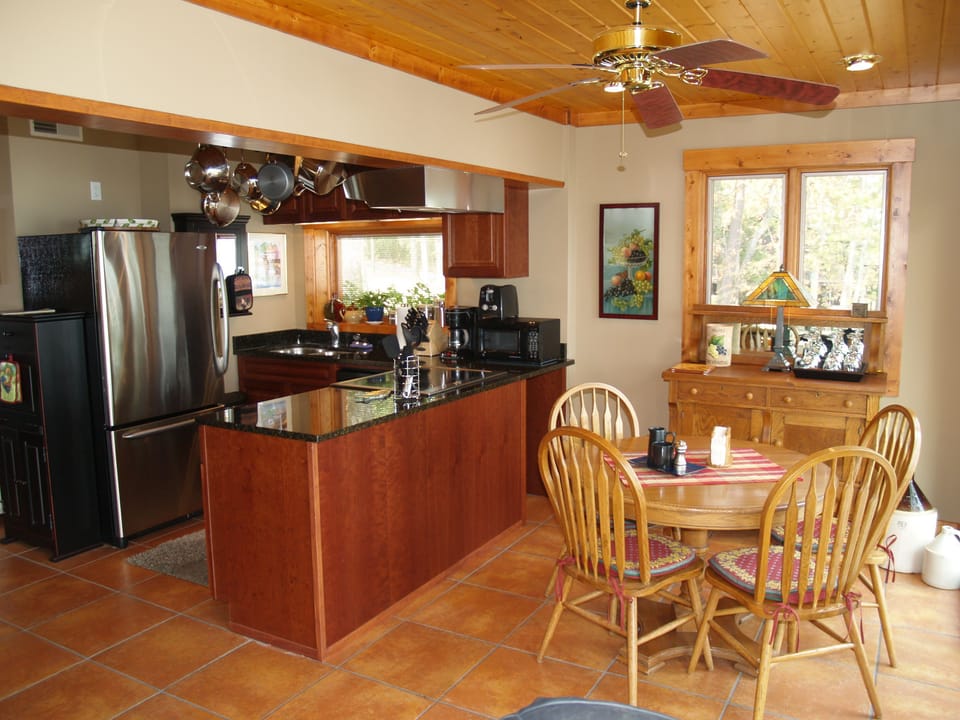 Kitchen with a lake view and Granite Countertops. 