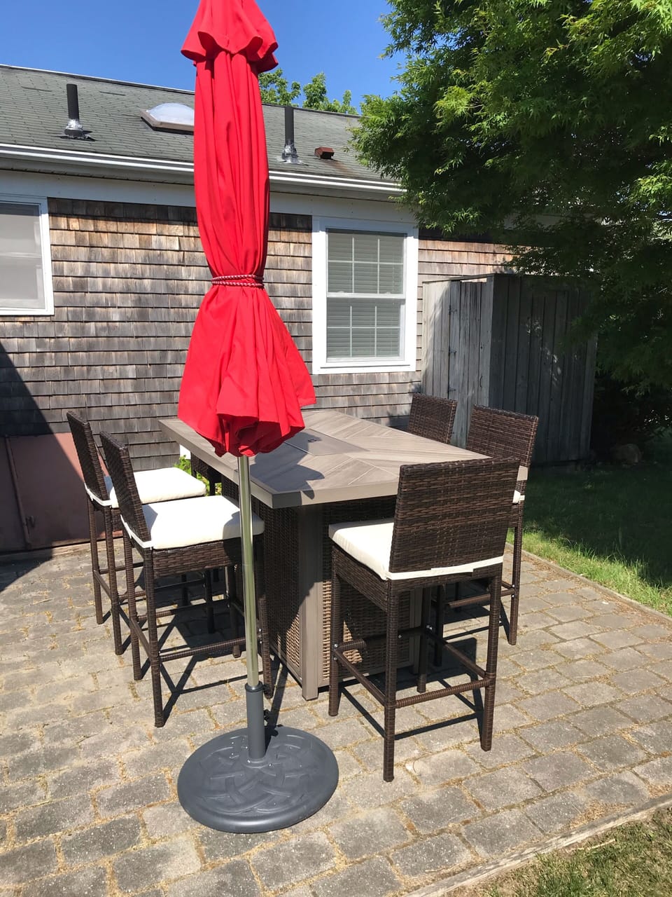 Patio with Bar height fire dining table and outdoor shower 