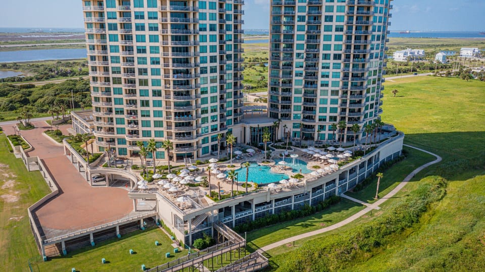 Overhead view of the extensive pool area and boardwalk to the beach. 