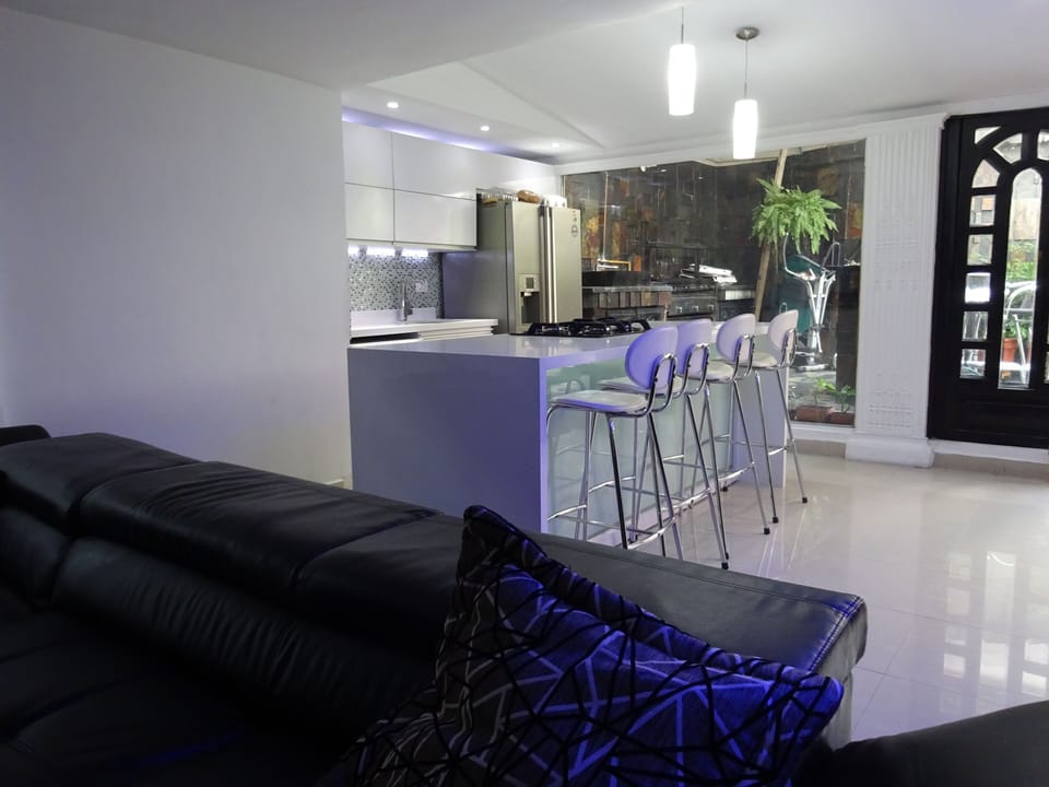 kitchen with 4 bar stools and large island