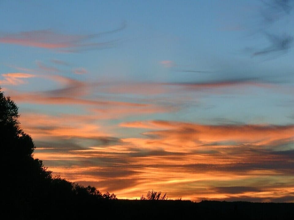 10 mile sunset view from house with no houses in view or few other human signs.