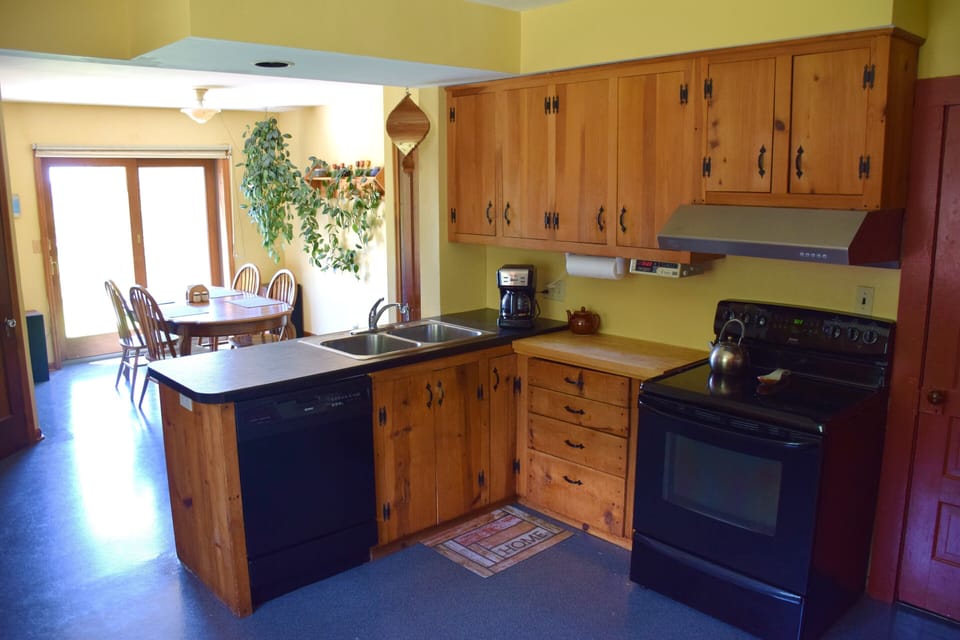 Kitchen with all modern appliances. Dining area has great sunset views.