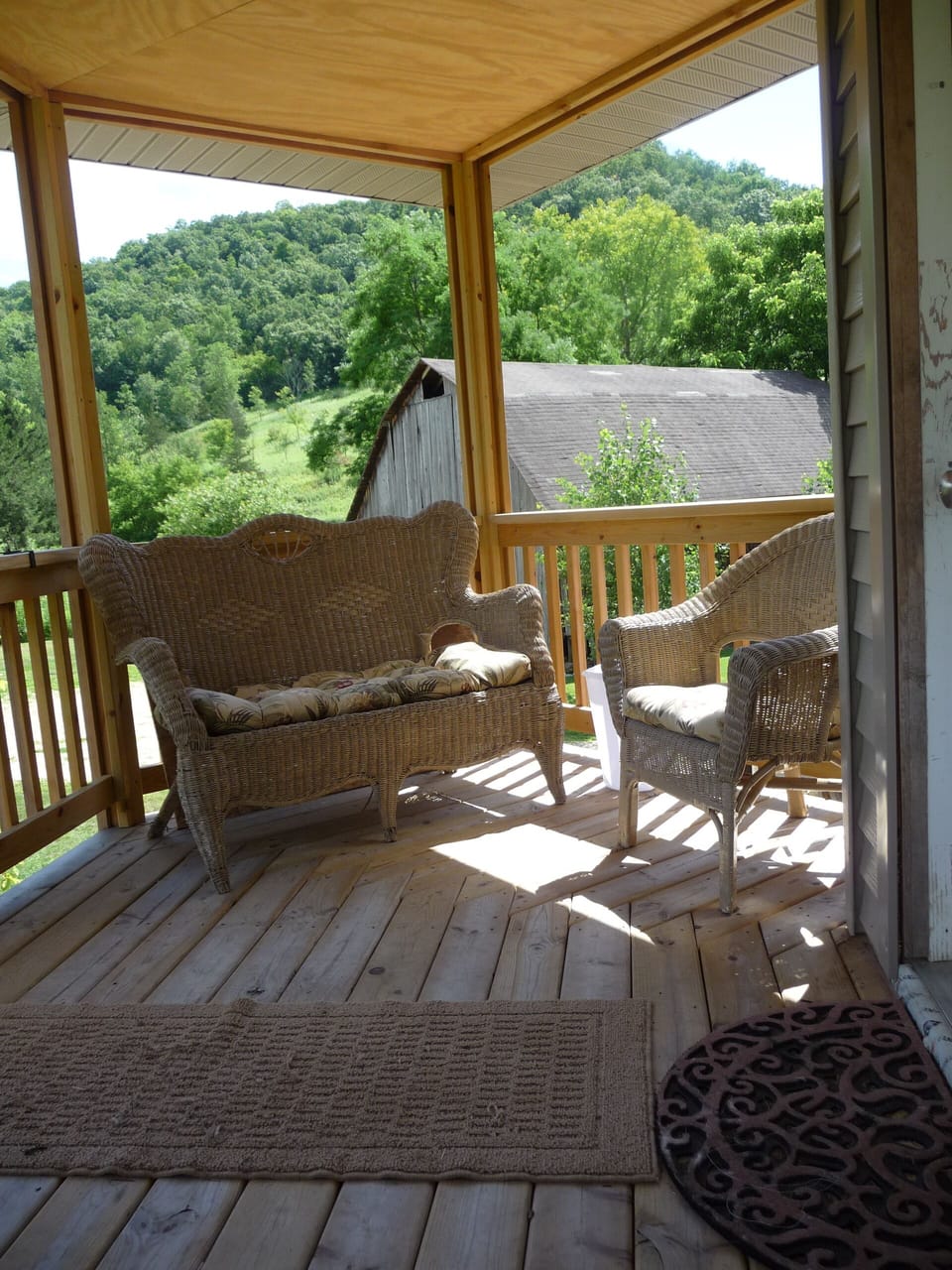 Corner end of porch with lots of seating