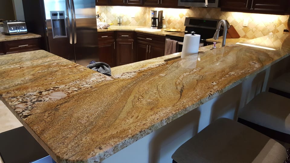 elegant granite breakfast bar that seats 4 people