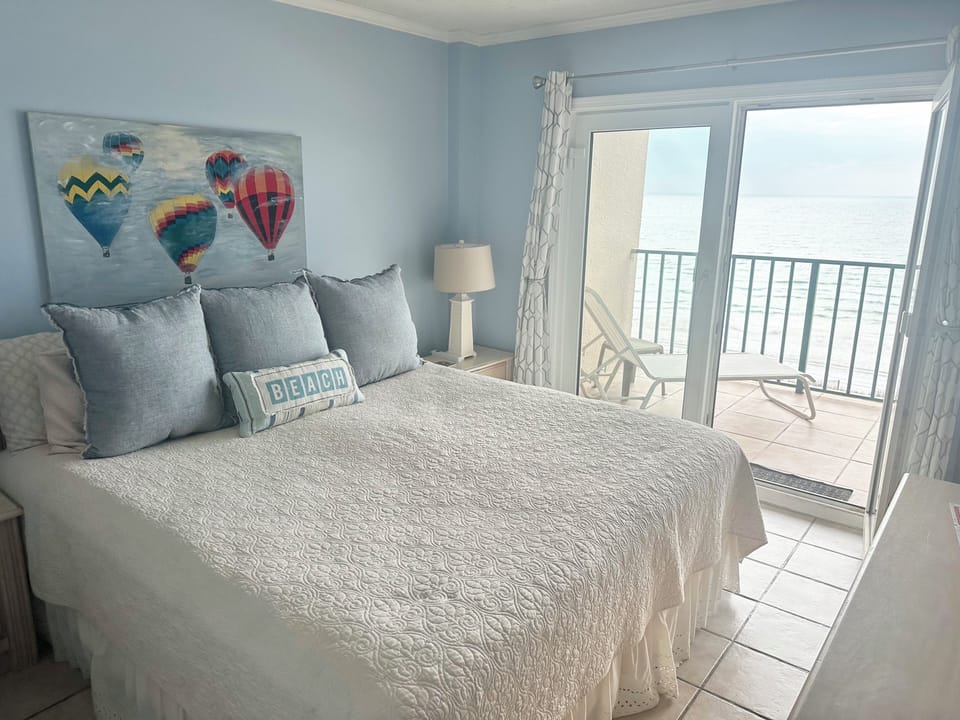 Balcony doors in primary beachfront bedroom