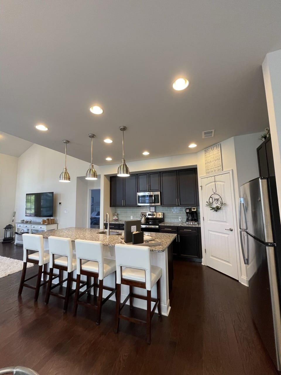 Kitchen, barstools, stainless steel appliances, large walk-in pantry, hardwood