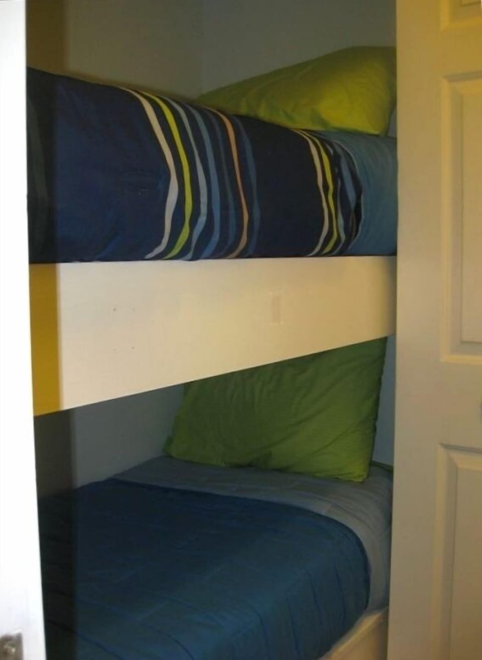 Crew bunks in hallway with doors for privacy