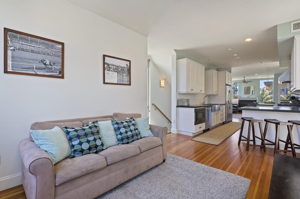 View of Great Room from Media Room across Gourmet Kitchen and Living/Dining area