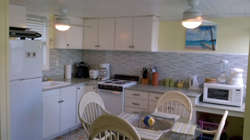 Bright open concept with 3 appliances and combined dining area