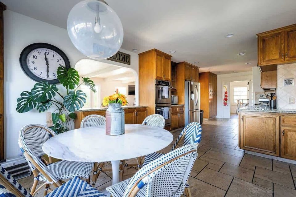 Gather in this bright dining space off the kitchen—perfect for wine lovers, golfers, families, or retreat groups to share meals, stories, and local flavors during their stay.