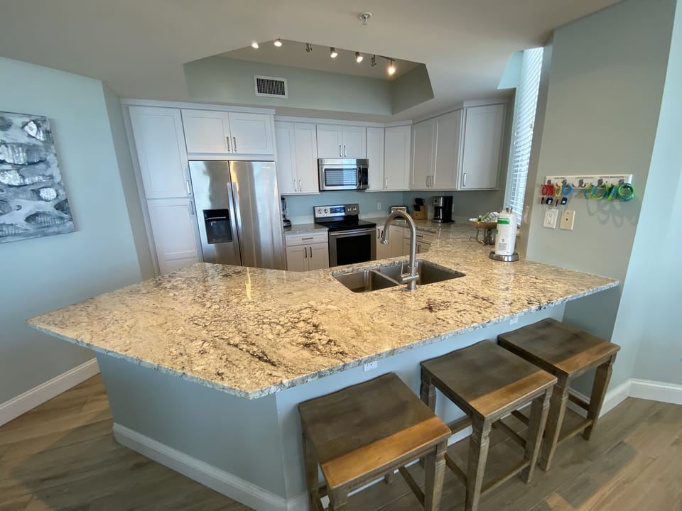 Custom shaker cabinet kitchen with white ice granite counters!