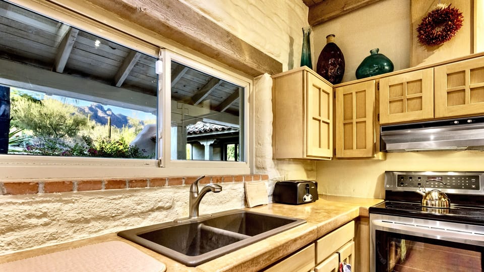 Enjoy Catalina Mtn views while preparing meals with quality cookware + utensils