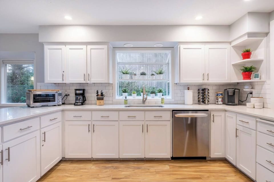 Cook, gather, and unwind in this bright, fully stocked kitchen — complete with stainless steel appliances, an induction range, and everything you need for family meals or morning coffee