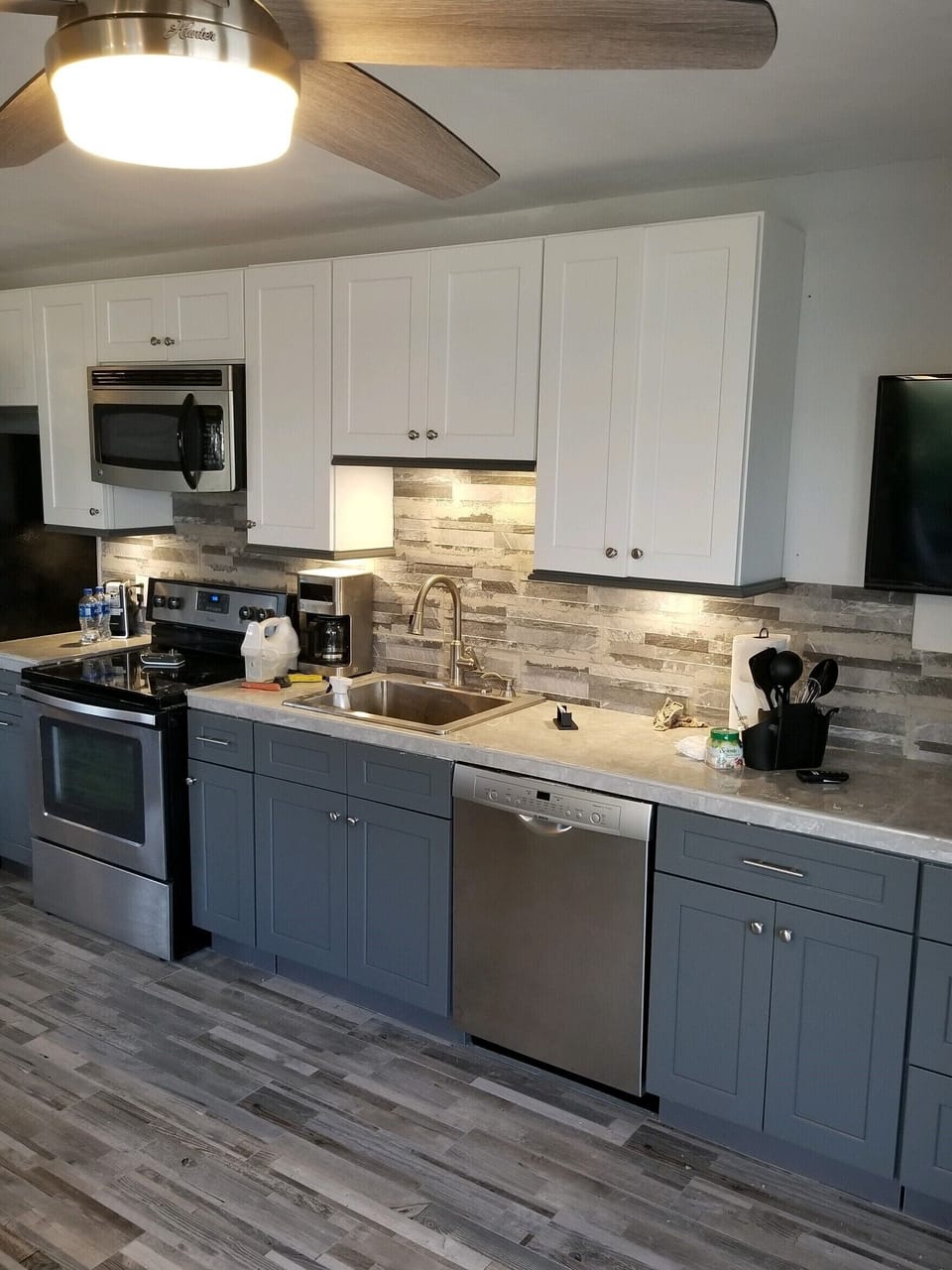 Summer 2019 - New kitchen cabinets, dishwasher, new floor.