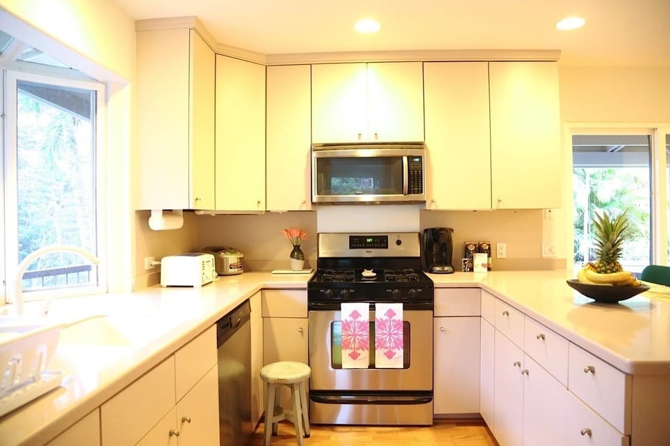 Fully-stocked kitchen and counter top area. Kitchen faces the river.
