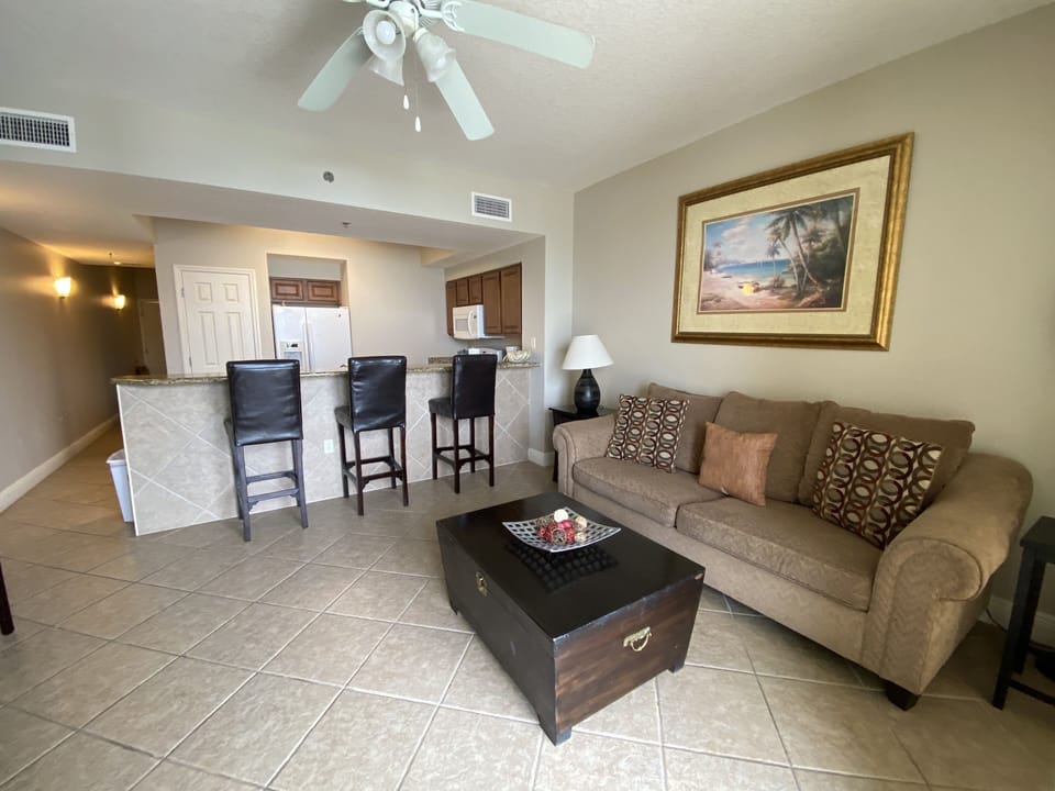 Kick back and relax in our open living area with balcony access and TV!