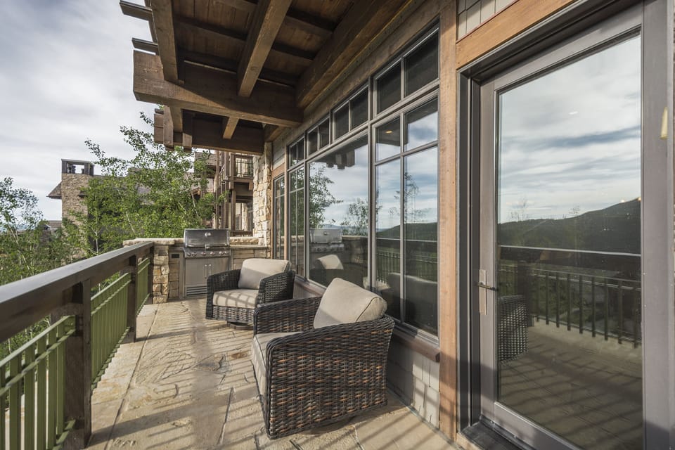 Stone deck with mountain views and built-in Weber grill