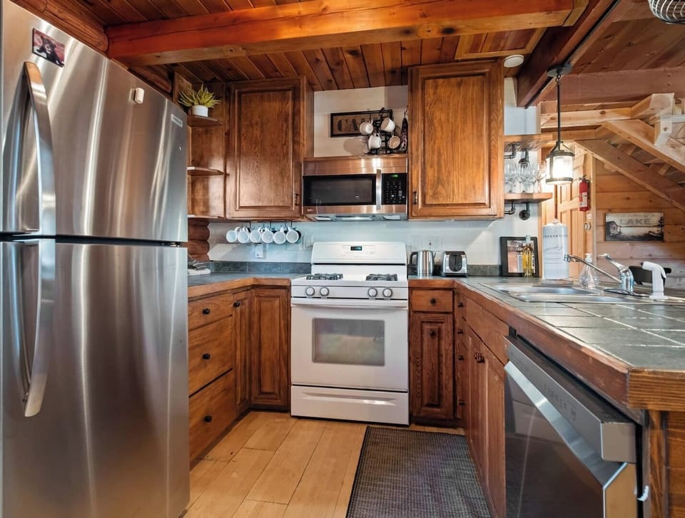 kitchen showcasing a seamless flow into the living room. Fully equipped with the essentials!
