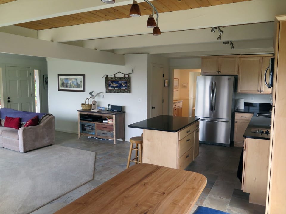 Old kitchen table in foreground--updated to nice live-edge wood table.