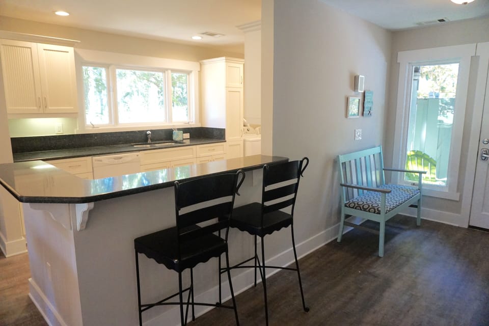 renovated kitchen with large picture window overlooking golf course