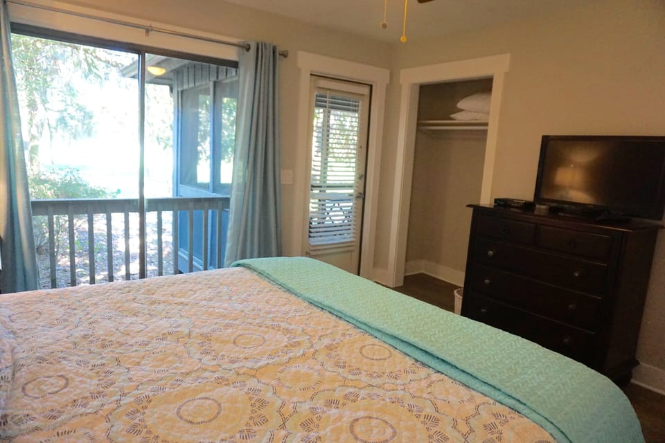 Relax with king bed, large dresser and flat screen TV,  connected to porch