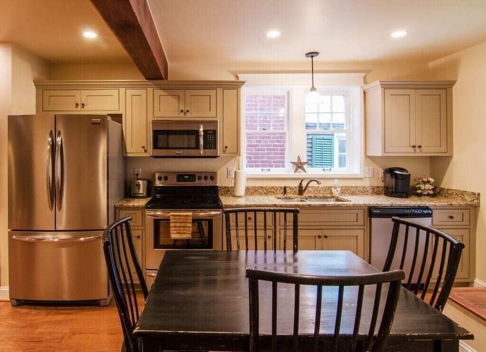 Full kitchen with seating for 6-8 (bench not shown).