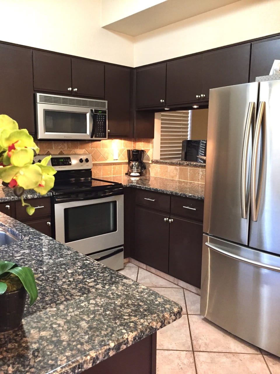 Kitchen is equipped w/ Stainless Steel appliances and Granite Counter Tops