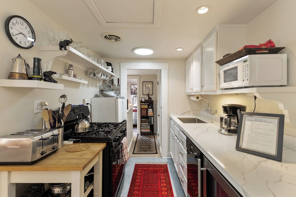 Kitchen facing rear of house toward back bedroom.
