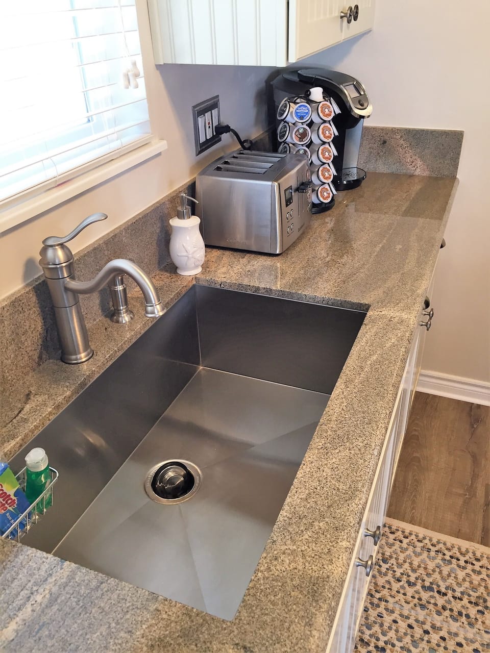 Granite counter tops with deep sink great for cleaning pots and pans.  