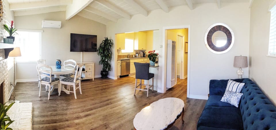 Panoramic of open Living, Dining & Kitchen areas.  