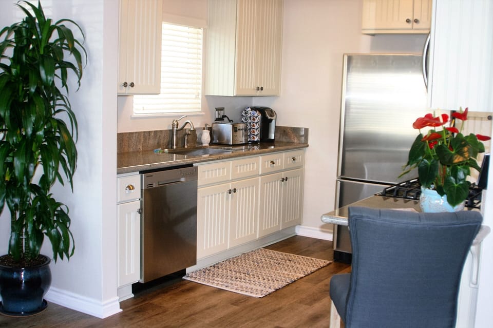 Panoramic of kitchen area.  Fully stocked for a simple or sophisticated meal.