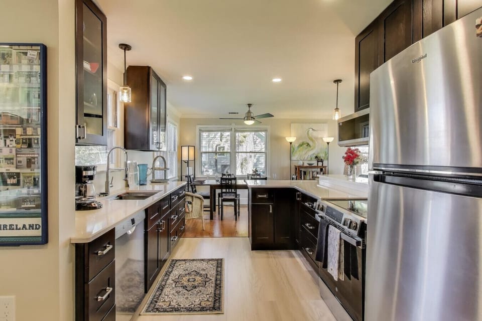 The spacious remodeled kitchen makes it easy to cook and connect while enjoying views toward the water.