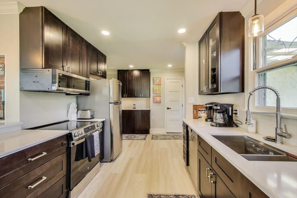 Prepare everything from morning coffee to family dinners in this fully stocked kitchen with modern appliances and ample counter space.