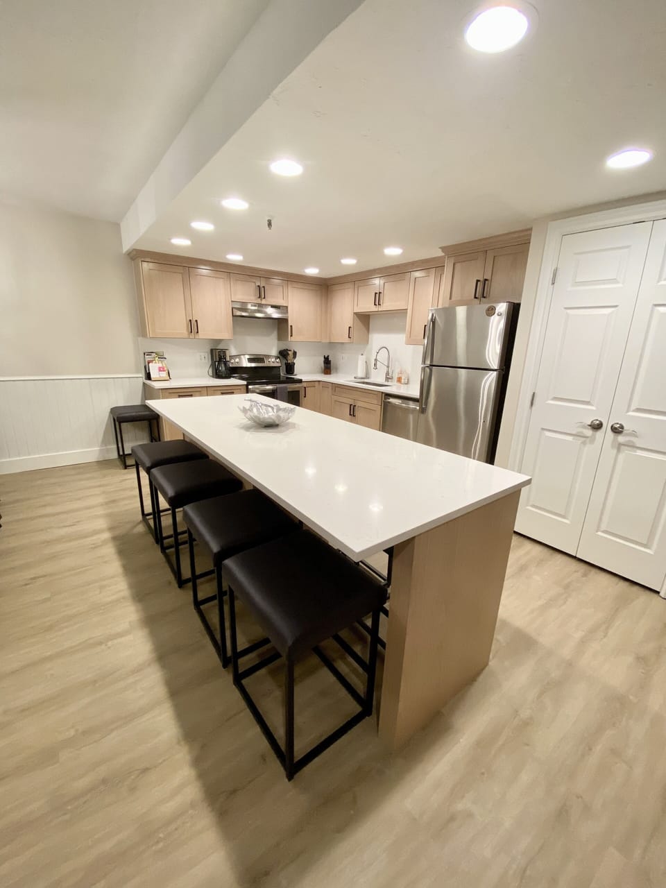 New white oak cabinets, quartz countertops & backsplash w/island bar to seat 8