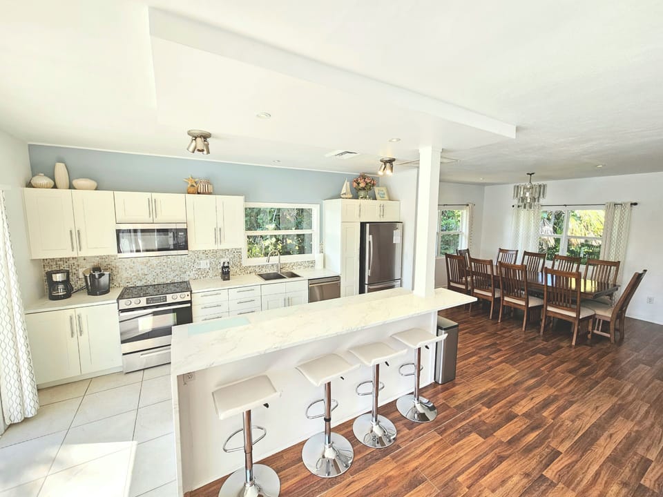 Fully Equipped Kitchen with Breakfast Bar.  Gas Grill Outside