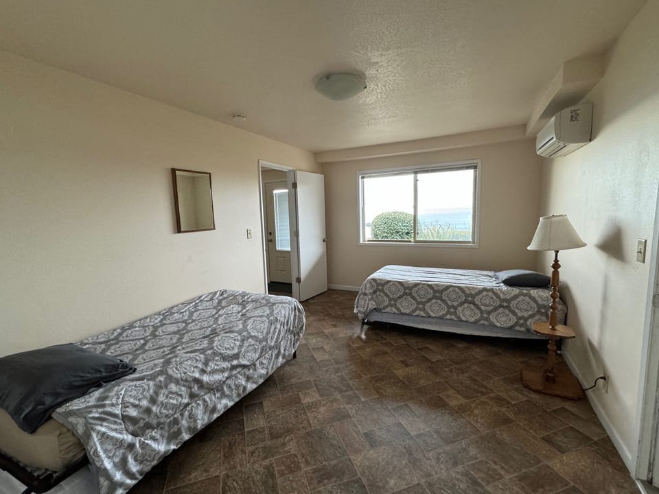 Twin beds with trundles underneath, downstairs