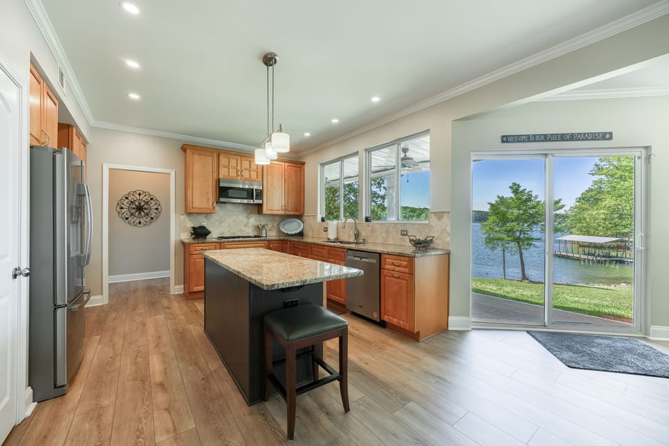 Well-stocked kitchen with central island and lots of counter space. Gas cook-top