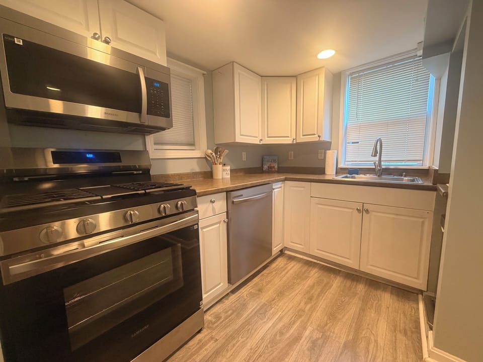 New stainless refrigerator, stove, microwave and dishwasher